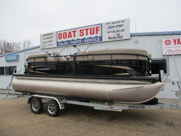 Starcraft LX20 R 2025 Starcraft LX20 R pontoon boat on trailer at dealership.