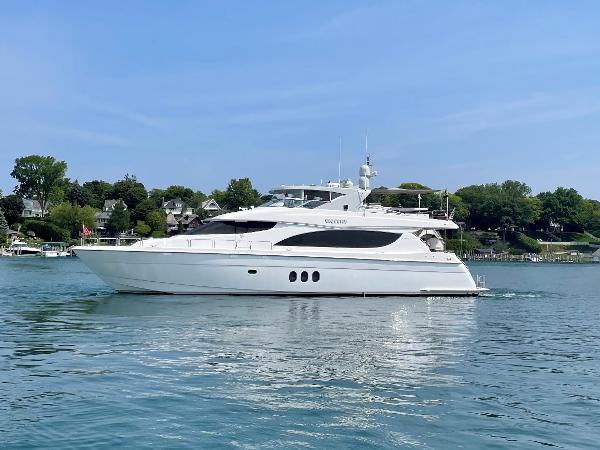 Hatteras 80 Motor Yacht 2008 Hatteras 80 Motor Yacht cruising on a calm lake with scenic shoreline.