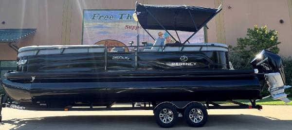 Regency 250 LE3 2024 Regency 250 LE3 pontoon boat on trailer, side view.