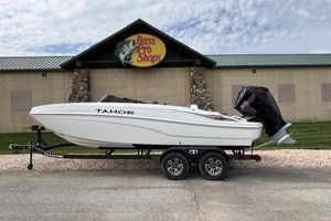 Tahoe T21 2025 Tahoe T21 boat on trailer outside Bass Pro Shops.