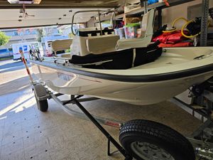 Boston Whaler 150 Montauk 2023 Boston Whaler 150 Montauk boat in garage on trailer.