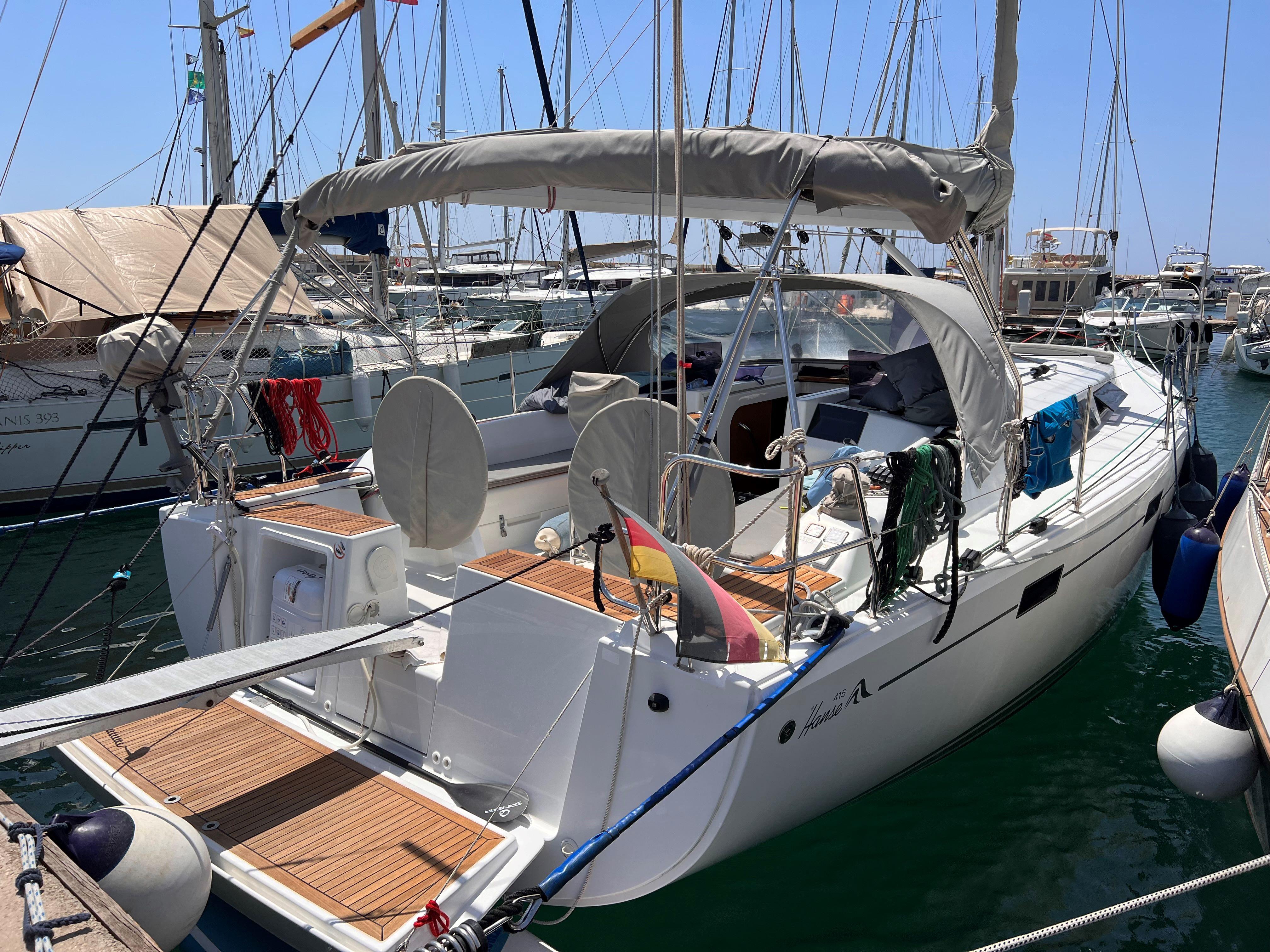 Hanse 415 Sailing yacht Hanse 415, 2014 model, docked in a marina with clear skies.