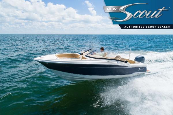 Scout 215 Dorado 2025 Scout 215 Dorado boat cruising on open water under a clear sky.