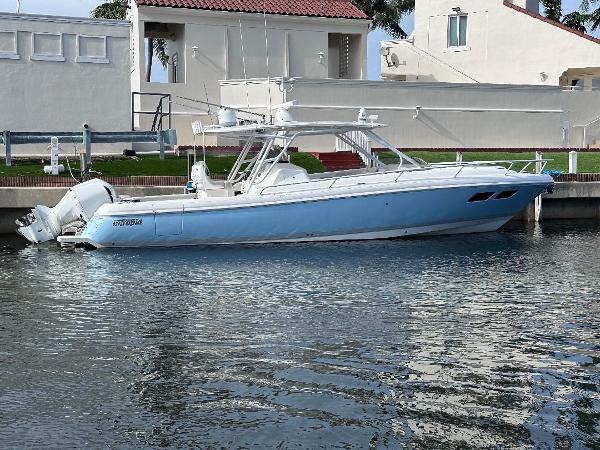 Intrepid 375 Walkaround 2016 Intrepid 375 Walkaround boat docked by waterfront homes.