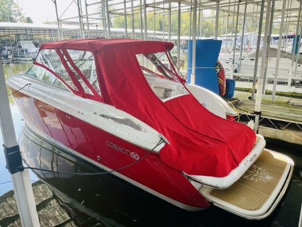 Cobalt 323 Red 2007 Cobalt 323 boat with canopy docked in marina.