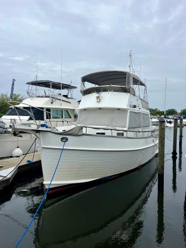 Grand Banks 49 Classic 1997 Grand Banks 49 Classic yacht docked at marina, overcast sky.