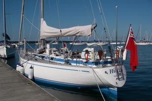 Nautor Swan 411 1980 Nautor Swan 411 sailboat docked, featuring a red flag and sleek design.