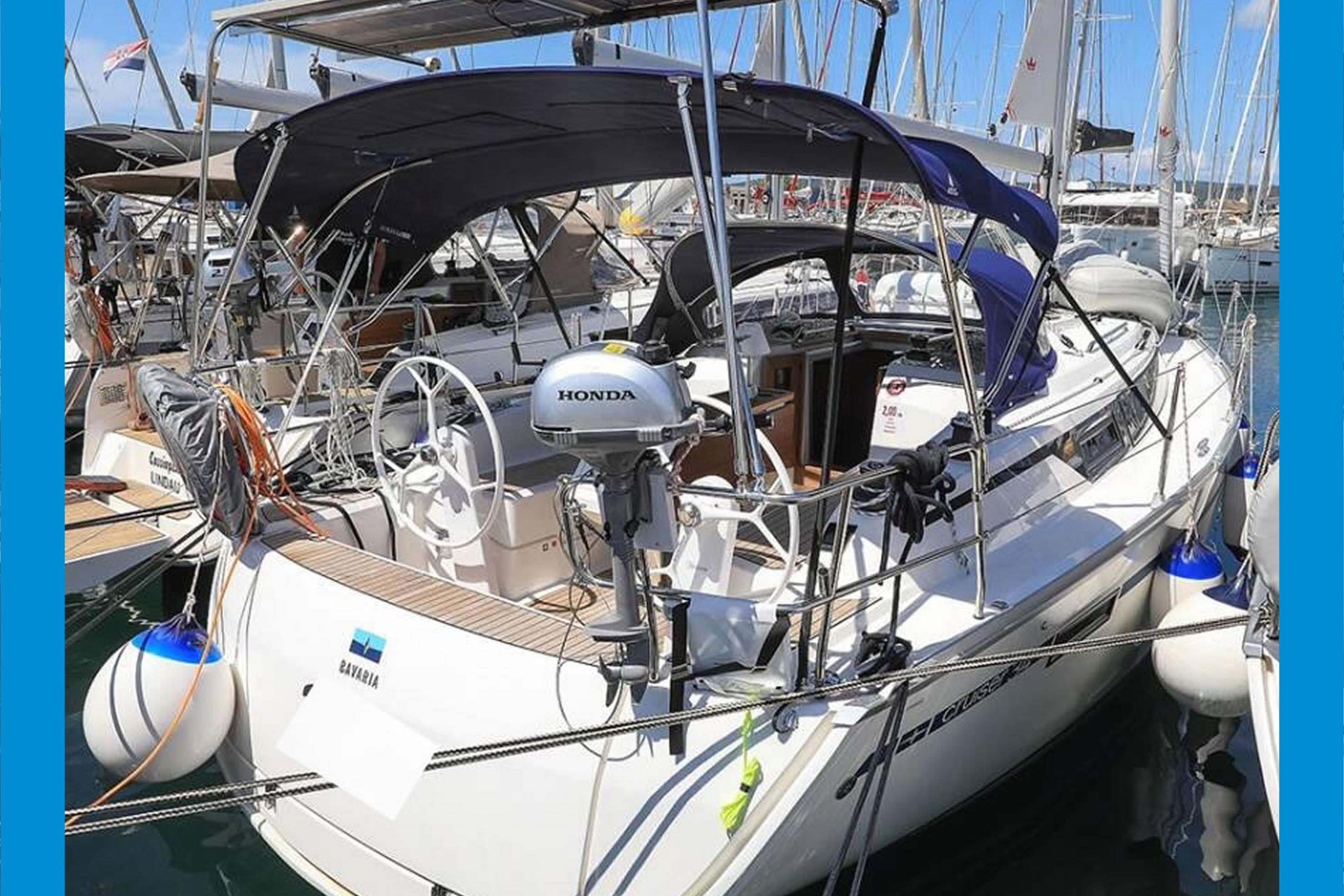 Bavaria Cruiser 34 2020 Bavaria Cruiser 34 yacht docked, featuring a Honda outboard motor and sleek design.