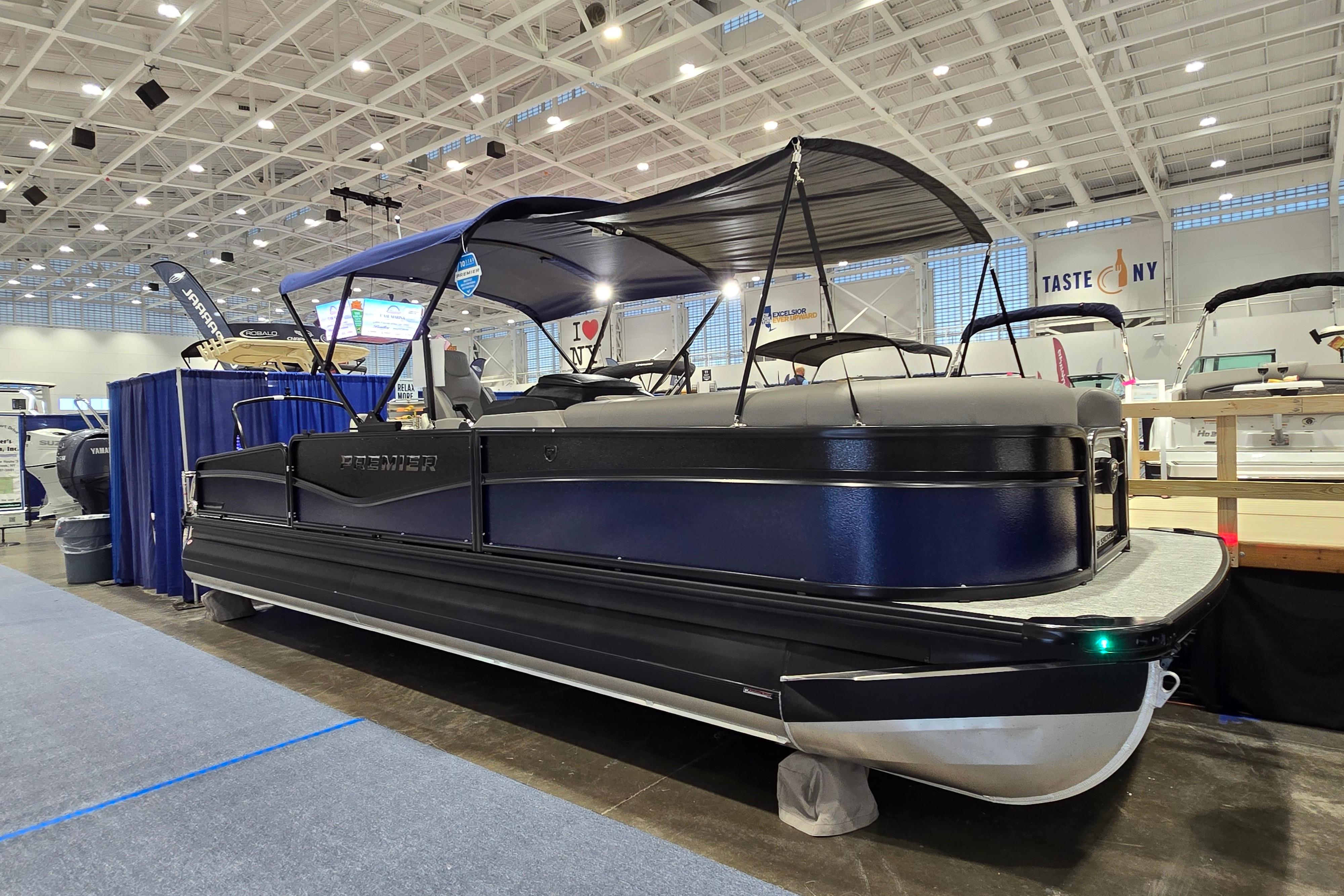 Premier 250 Sunsation RS 2025 Premier 250 Sunsation RS pontoon boat displayed at an indoor boat show.