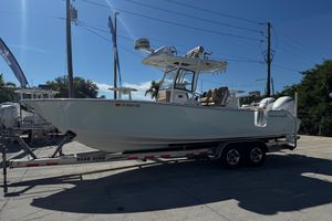 Sportsman Open 282TE Center Console 2018 Sportsman Open 282TE Center Console boat on trailer, parked outdoors.