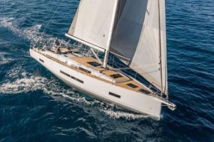 Hanse 460 2024 Hanse 460 yacht sailing on open sea with full sails.