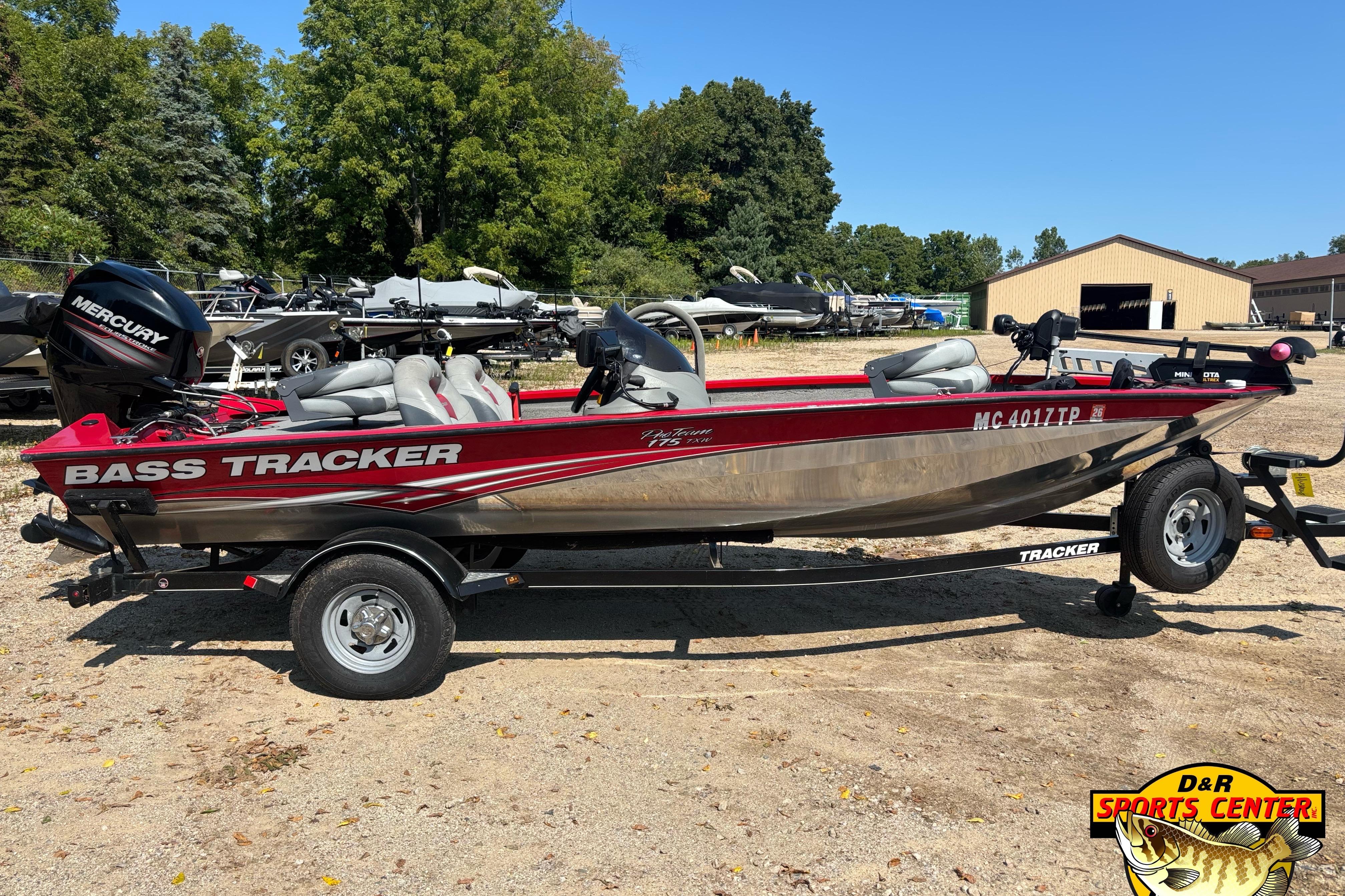 Tracker Pro Team 175 TXW 2013 Tracker Pro Team 175 TXW bass boat on trailer, featuring Mercury engine.
