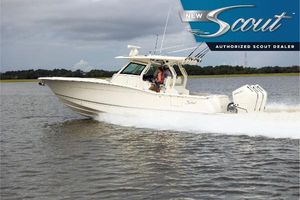 Scout 357 LXF 2025 Scout 357 LXF boat cruising on a lake, showcasing sleek design and powerful performance.