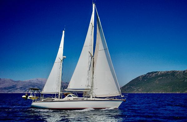 Amel Santorin Sailing yacht Amel Santorin 1994 on open sea with clear blue sky.