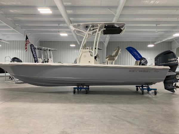 Key West 250 Bay Reef 2024 Key West 250 Bay Reef boat displayed in a showroom.