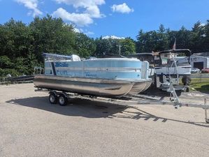 Berkshire 22E CTS 2025 Berkshire 22E CTS pontoon boat on trailer, parked outdoors under a clear sky.