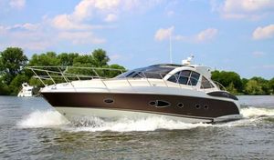 Atlantis Atlantis 50 ht Luxury yacht Atlantis 50 HT cruising on a river, 2007 model, under a partly cloudy sky.