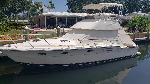 Tiara Yachts 3600 Convertible Sportfish 1994 Tiara Yachts 3600 Convertible Sportfish docked near waterfront home.