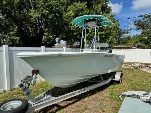Sportsman Island Reef 19 Center Console 2016 Sportsman Island Reef 19 Center Console boat on trailer, parked outdoors.