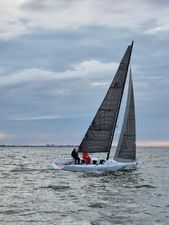 Esse 850 LE Sailboat Esse 850 LE 2020 on open water under cloudy sky.