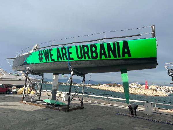 Custom TP52 Custom TP52 yacht with "#WE ARE URBANIA" text, docked at a marina, 2007 model.