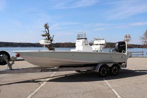 Blazer 2220 Fisherman 2024 Blazer Bay 2220 Fisherman boat on trailer by a scenic lake.