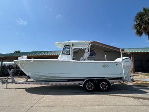 Sea Hunt Gamefish 28 Coffin Box 2025 Sea Hunt Gamefish 28 with Coffin Box on trailer, parked outdoors under clear sky.