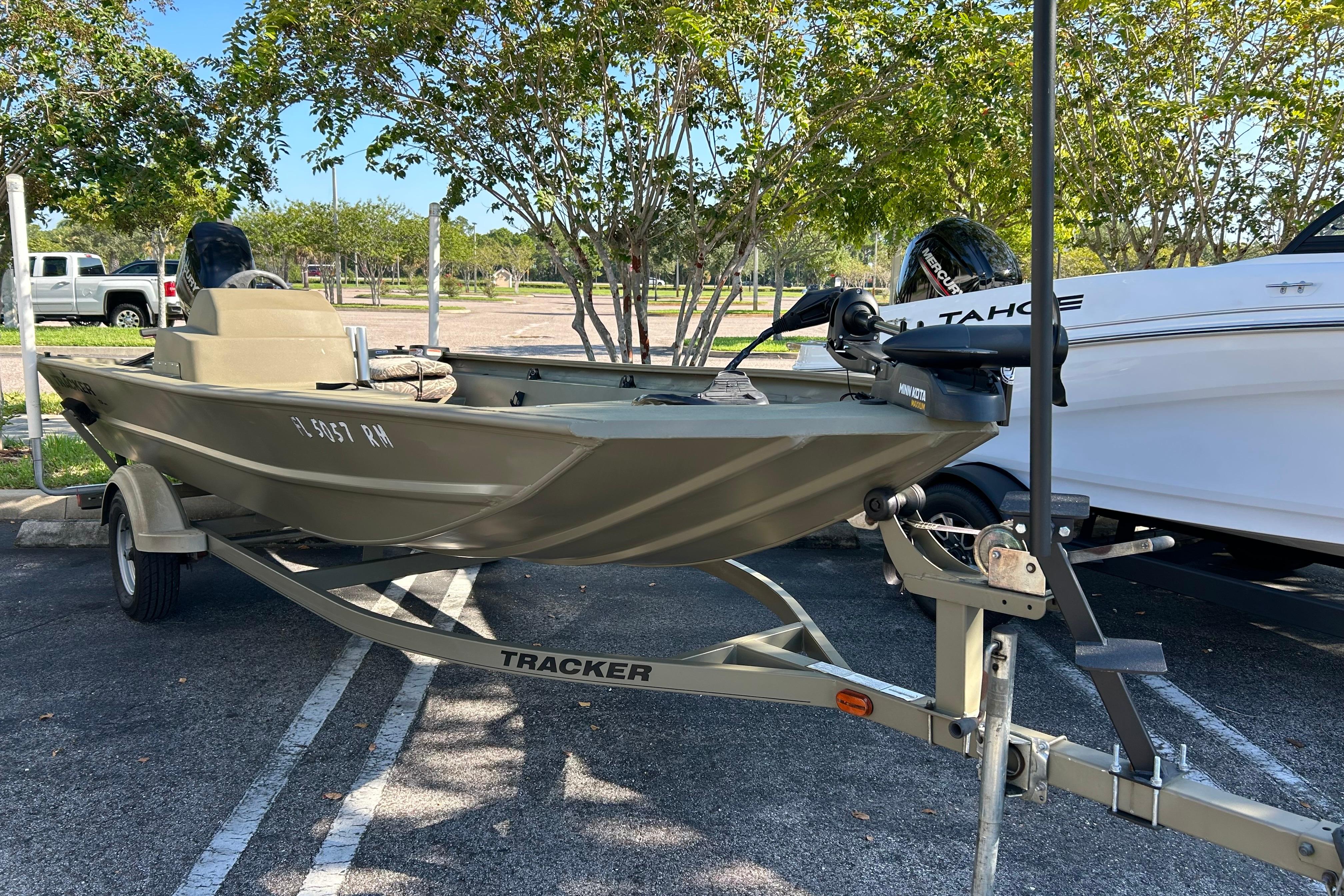 Tracker Grizzly 1754 MVX SC 2017 Tracker Grizzly 1754 MVX SC boat on trailer in parking lot.