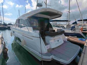 Bavaria R40 Coupe 2023 Bavaria R40 Coupe yacht docked in a marina under a partly cloudy sky.