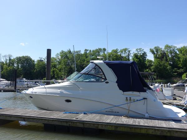 Rinker 330 Express Cruiser 2008 Rinker 330 Express Cruiser docked at a marina, surrounded by trees and boats.