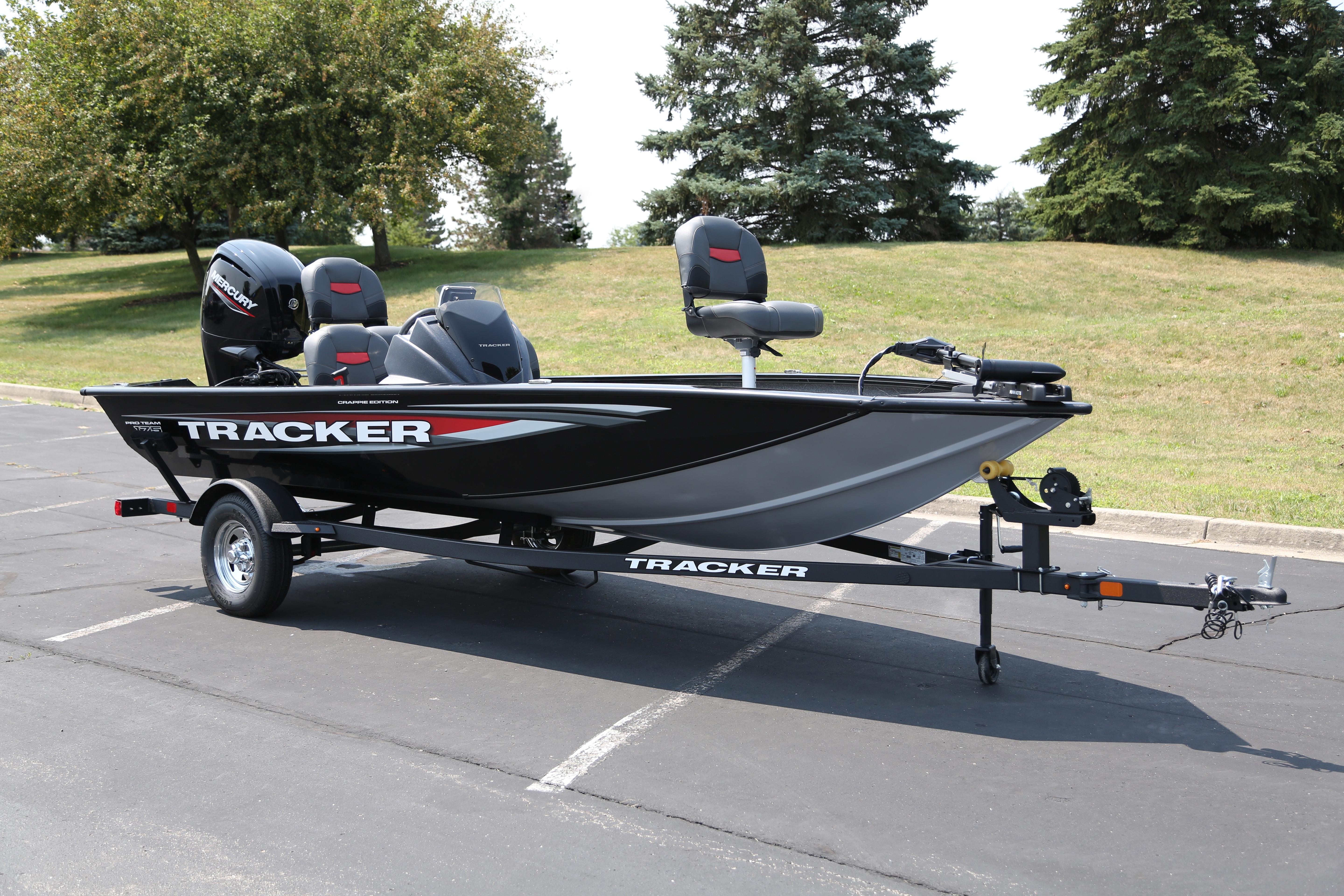 Tracker Pro Team 175 Crappie Edition 2026 Tracker Pro Team 175 Crappie Edition boat on trailer in parking lot.