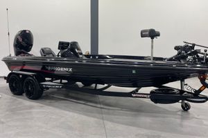Phoenix 21 PHX 2021 Phoenix 21 PHX boat in showroom, black with red accents, on trailer.