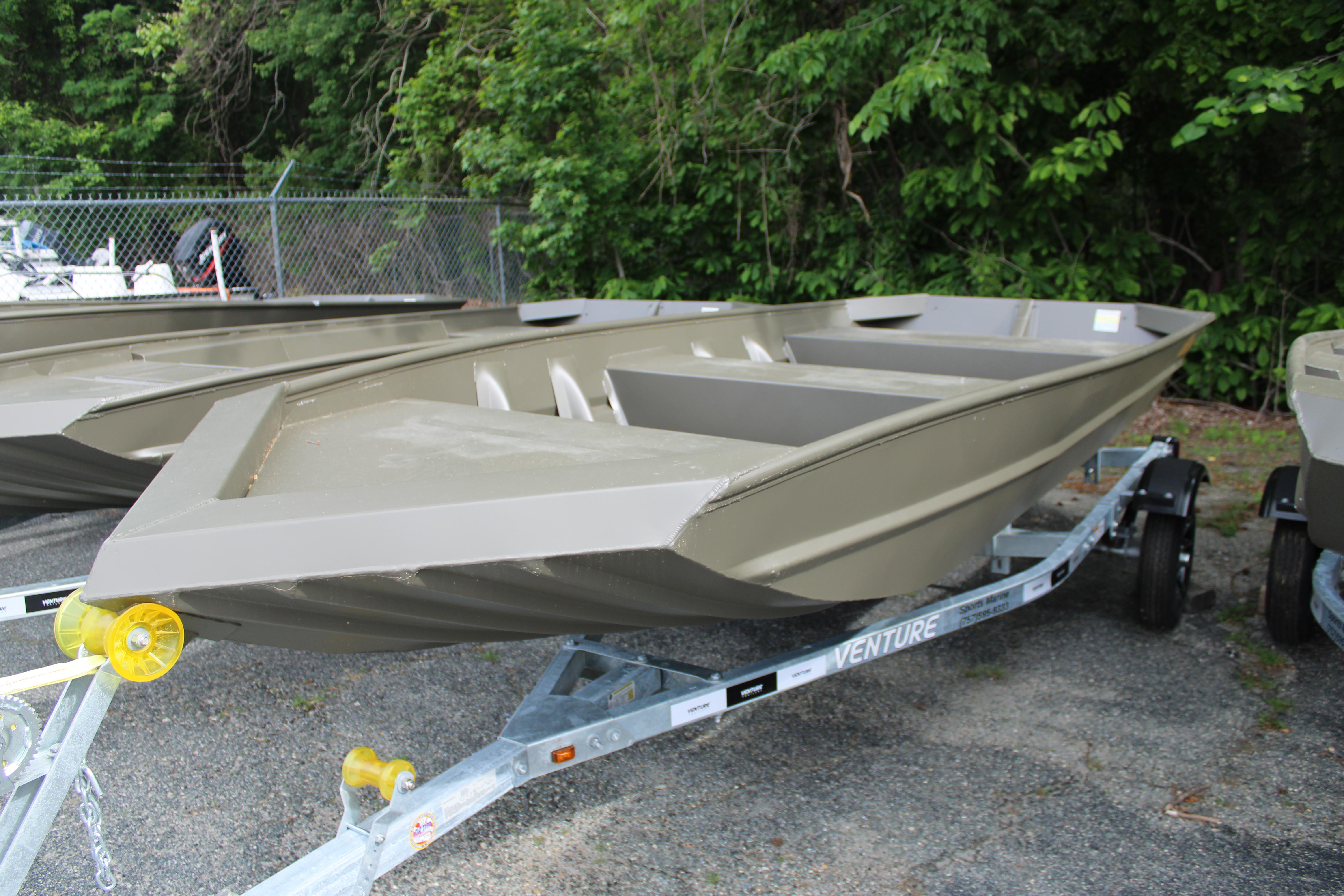 WeldBilt 1548V 2025 WeldBilt 1548V boat on trailer, parked outdoors near greenery.