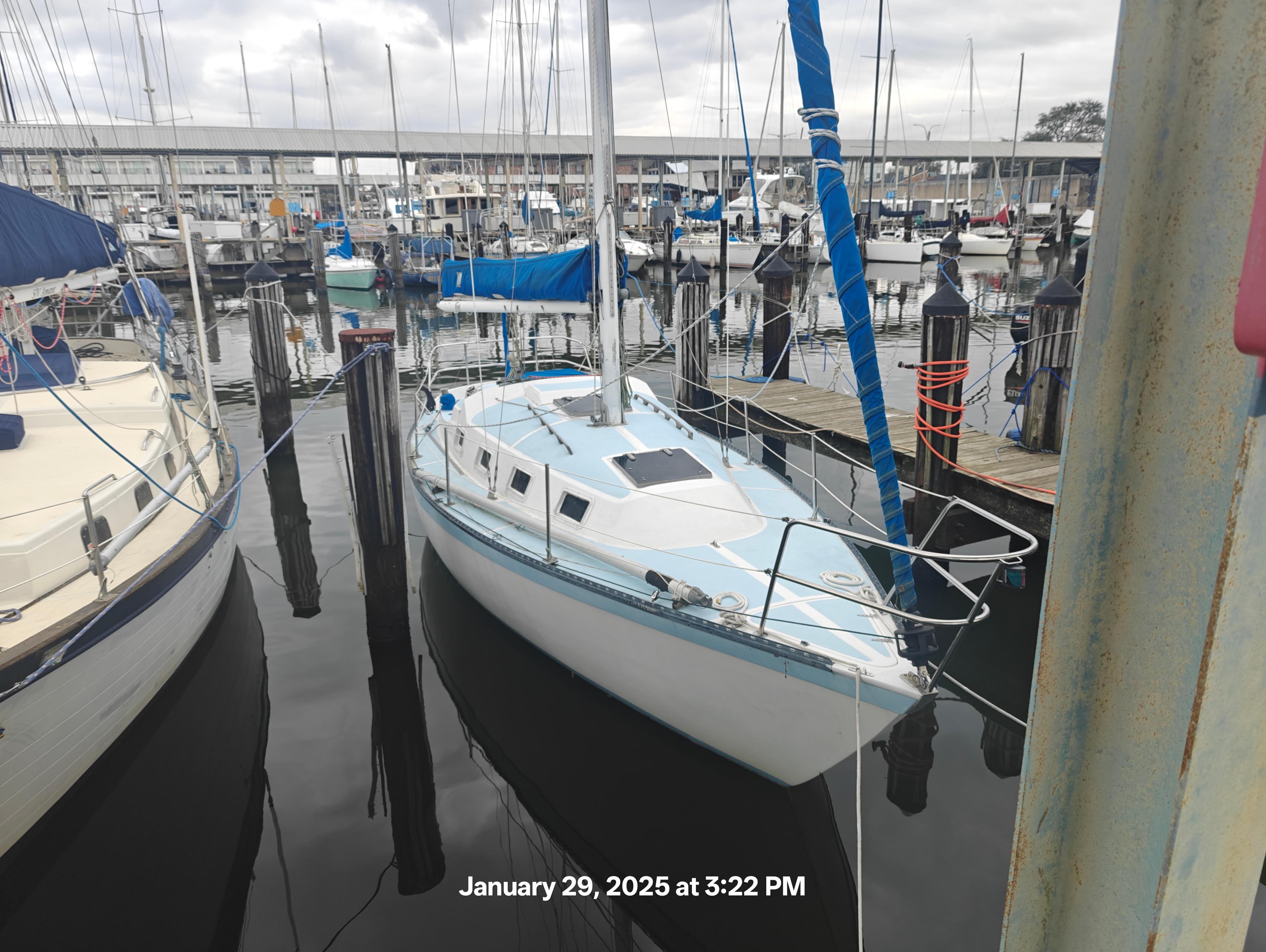 Lancer Yachts 30 Sloop 1979 Lancer Yachts 30 Sloop docked at marina, overcast sky.