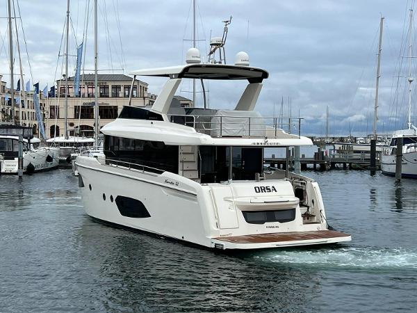Absolute 52 Navetta 2021 Absolute 52 Navetta yacht docked in a marina, showcasing sleek design and luxury features.
