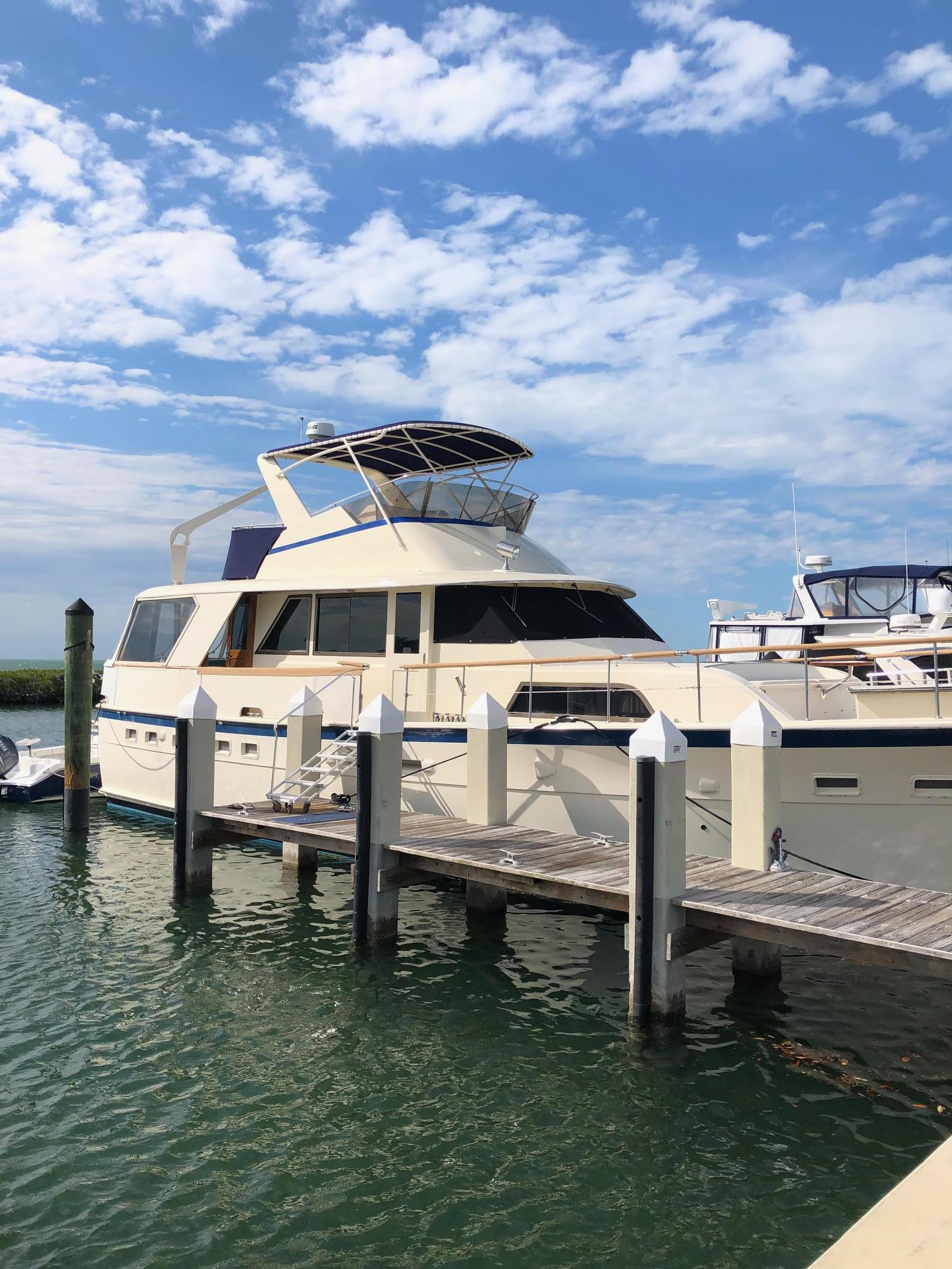 Hatteras 53 Motoryacht 1980 Hatteras 53 Motor Yacht docked under a blue sky.