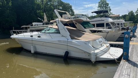 Sea Ray 400 Sea Ray 1997 Sea Ray 400 yacht docked at a marina on a sunny day.