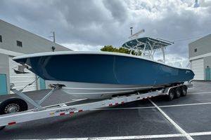 Yellowfin 34 Offshore 2025 Yellowfin 34 Offshore boat on trailer, parked in industrial area.