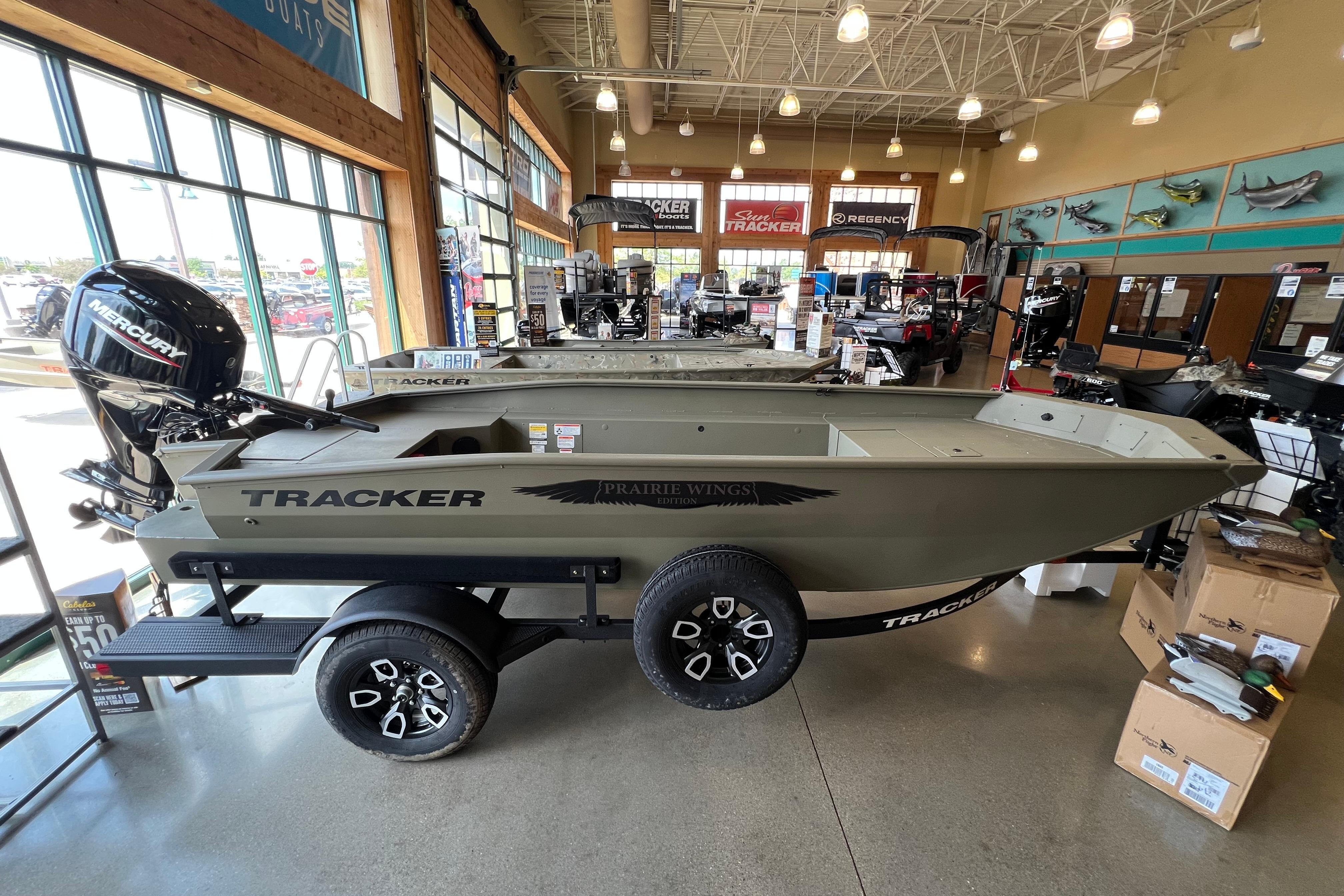 Tracker Grizzly 1650 T Prairie Wings Edition 2026 Tracker Grizzly 1650 T Prairie Wings Edition boat displayed in showroom.