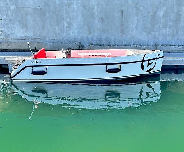 Vision Marine Technologies Volt 180 2023 Vision Marine Technologies Volt 180 boat docked on calm water.