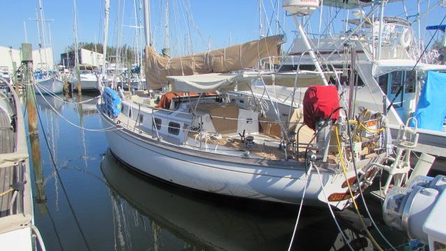Shannon Cutter 1985 Shannon Cutter sailboat docked in a marina, surrounded by other boats.