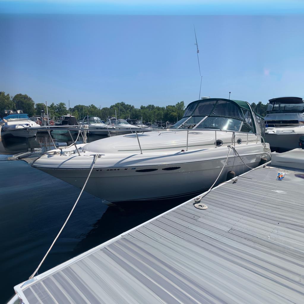 Sea Ray 340 Sundancer 2001 Sea Ray 340 Sundancer docked at marina, sunny day, calm waters.