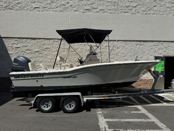 Grady-White 191 Coastal Explorer 2015 Grady-White 191 Coastal Explorer boat on a trailer with a black canopy.