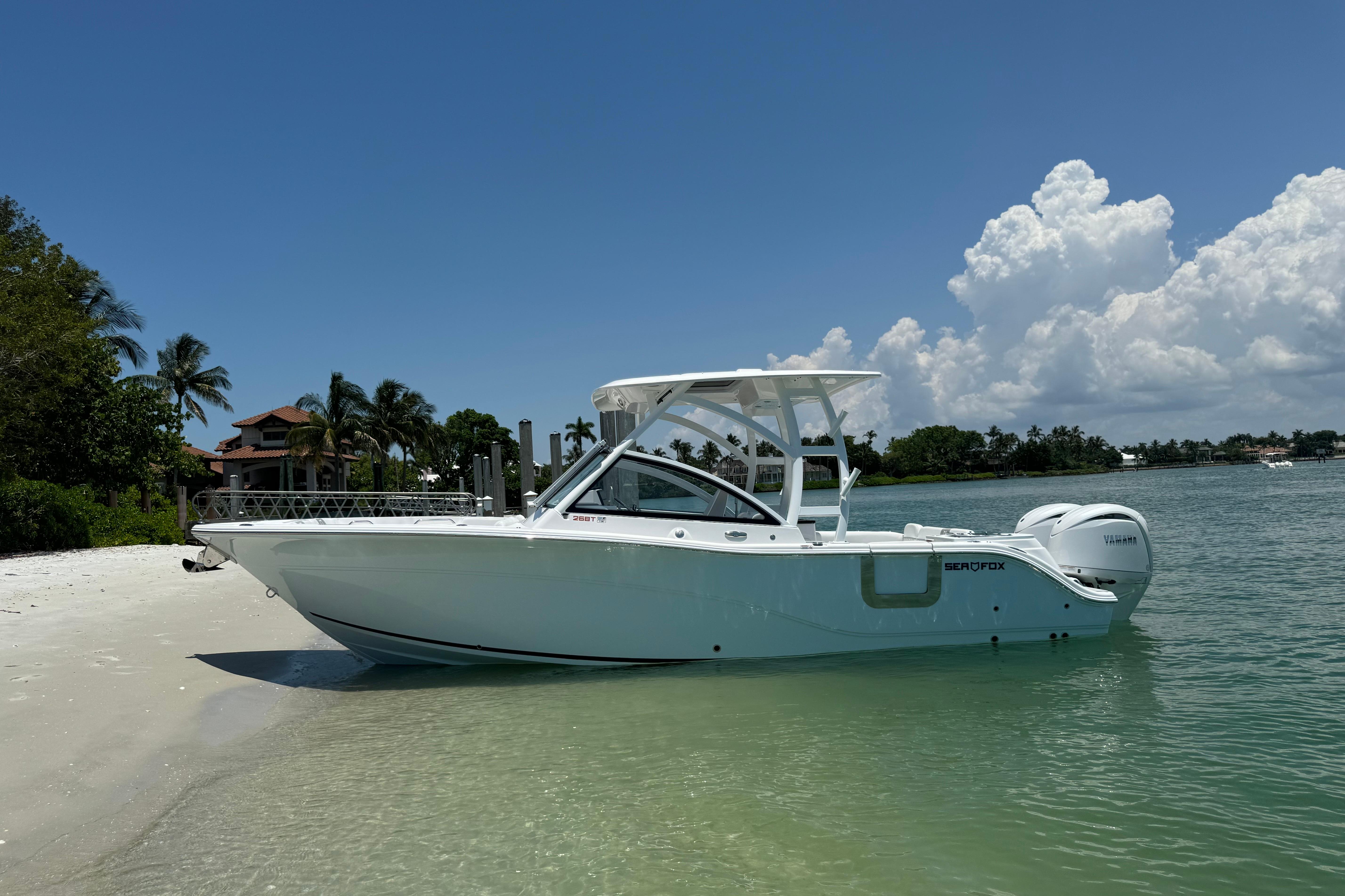 Sea Fox 268 Traveler 2024 Sea Fox 268 Traveler boat on a sunny beach with clear skies.