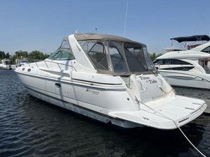 Cruisers Yachts 3870 Esprit 1998 Cruisers Yachts 3870 Esprit docked on calm water, featuring sleek white design.