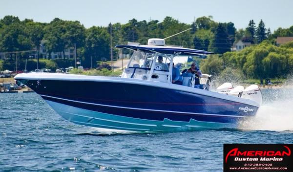 Fountain 38 SC 2022 Fountain 38 SC boat cruising on a lake, American Custom Marine logo.