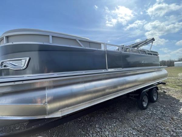 Avalon VENTURE 85 QL 2024 Avalon VENTURE 85 QL pontoon boat on a trailer under a blue sky.