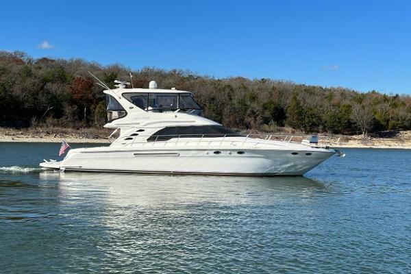 Sea Ray 560 Sedan Bridge 2001 Sea Ray 56 Sedan Bridge yacht cruising on a calm lake.