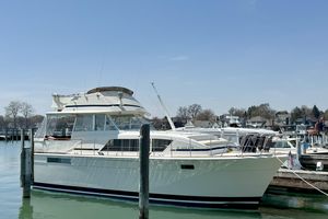 Chris-Craft 410 Commander Yacht 1978 Chris-Craft 410 Commander yacht docked at a marina on a clear day.