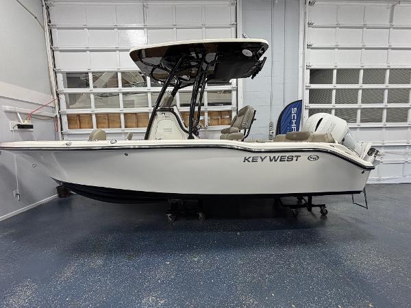 Key West 219 FS 2023 Key West 219 FS boat in showroom, side view, white exterior.